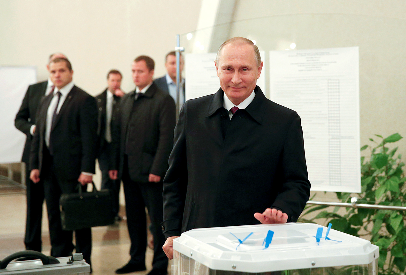 Russian President Vladimir Putin visits a polling station during a parliamentary election in Moscow, Sept. 18, 2016