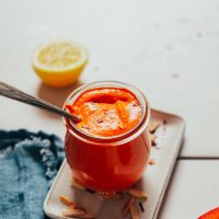 Jar of homemade creamy Romesco Sauce on a small tray