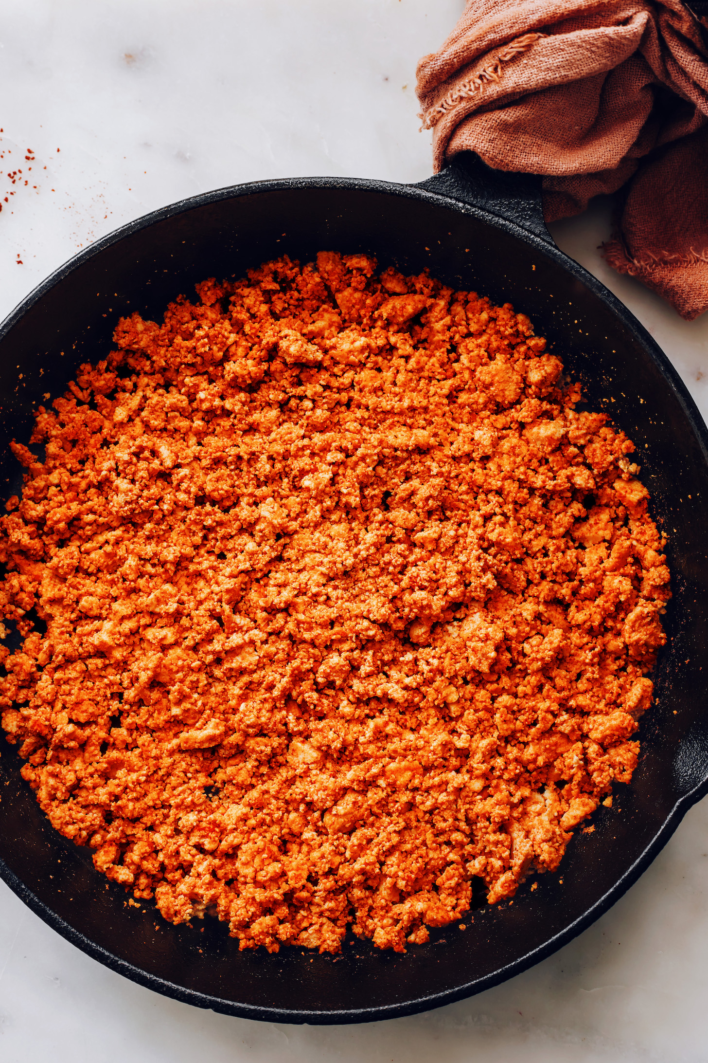 Cooking vegan chorizo sausage in a skillet