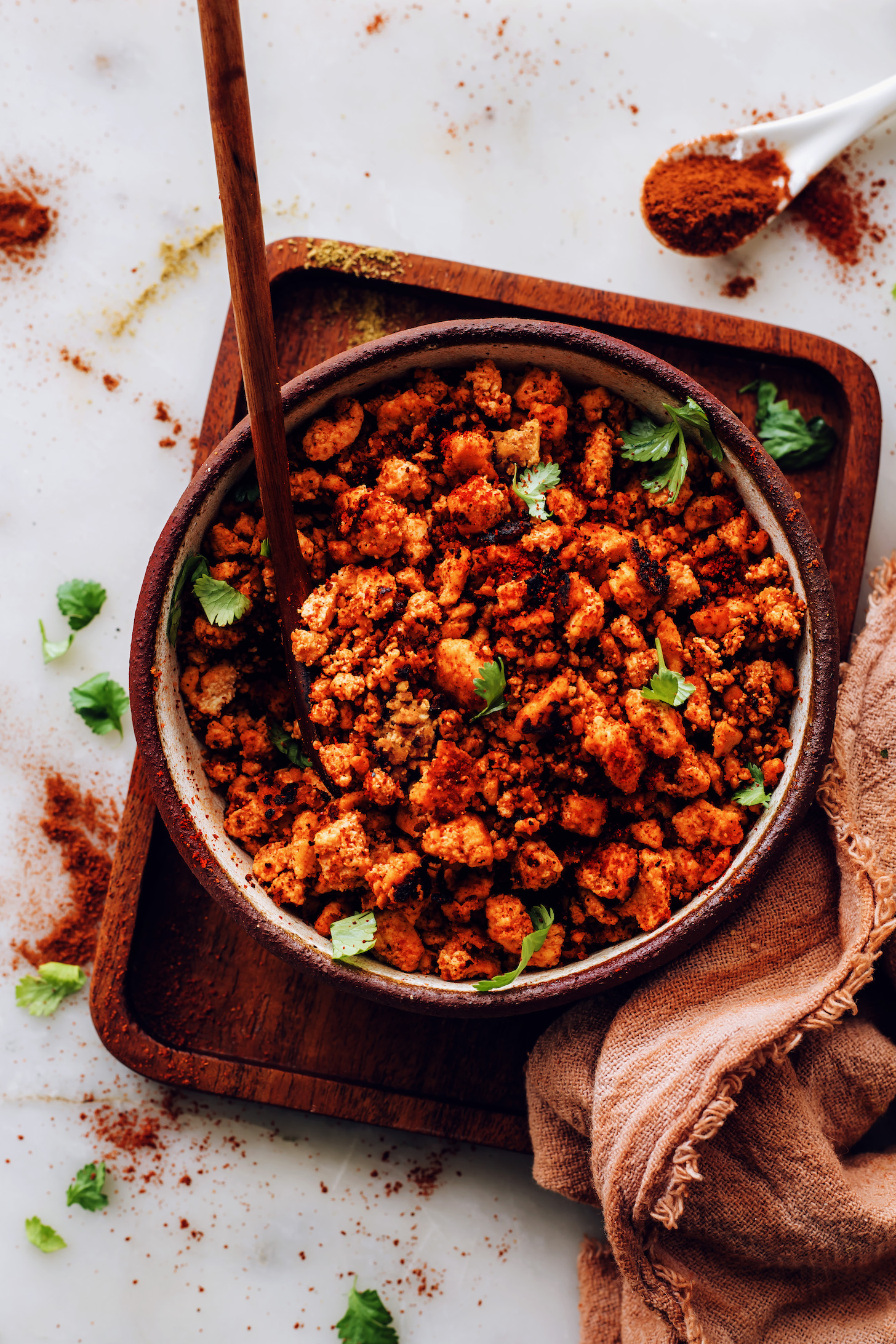 Bowl of crispy vegan chorizo sausage sprinkled with fresh cilantro