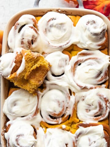 pumpkin cinnamon rolls with cream cheese frosting.