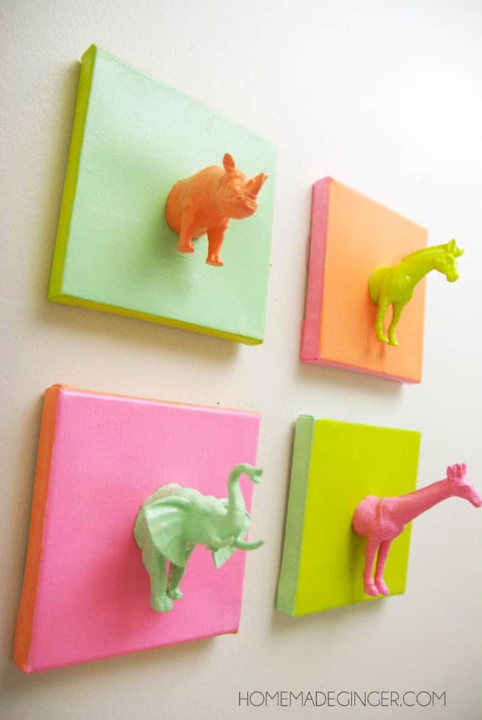 Plastic animals on mini canvases