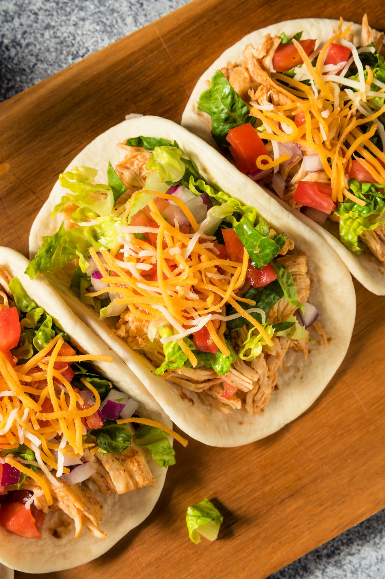 Homemade Shredded Chicken Tacos with Lettuce Cheese Tomatoes