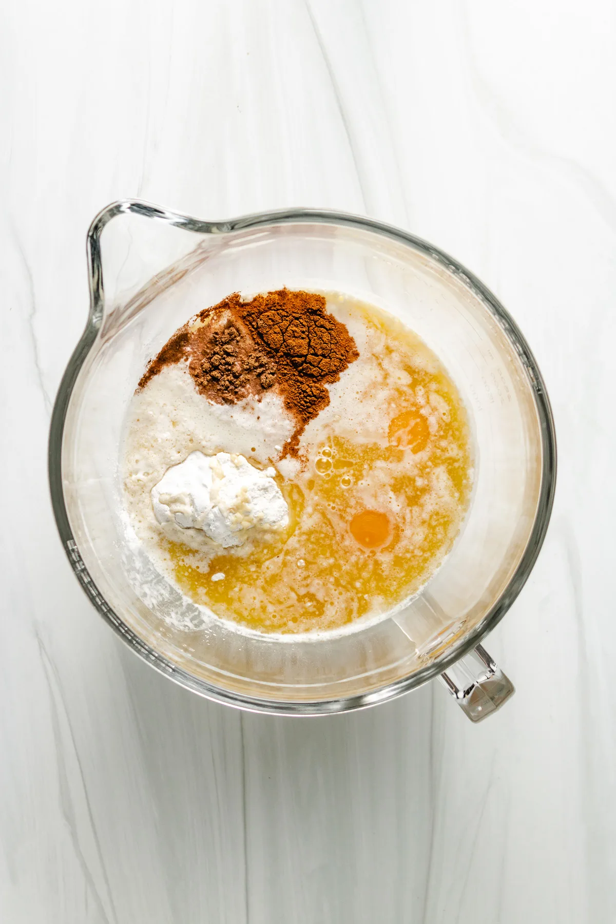 Top down view of the ingredients for muffin batter in a bowl.