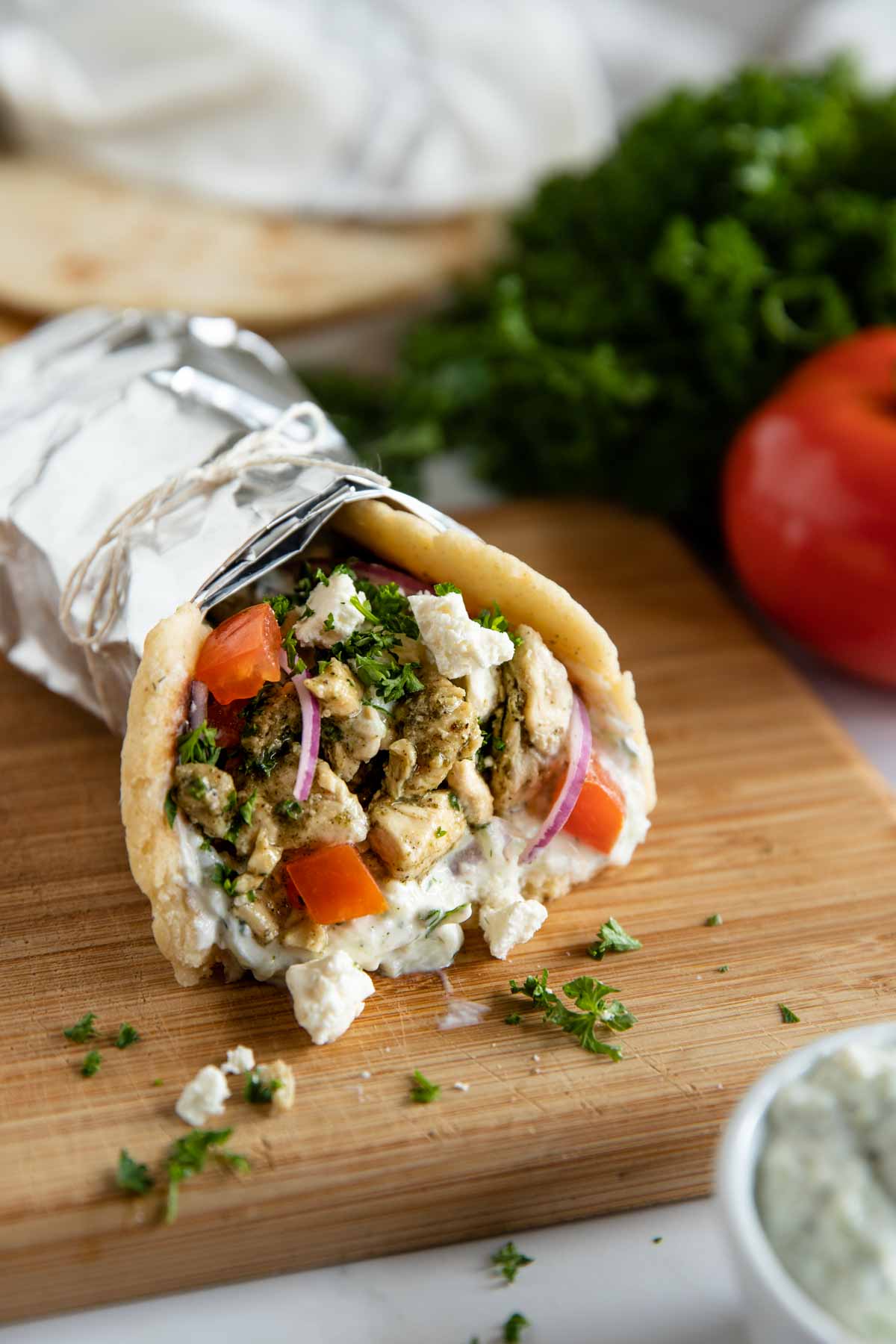 easy chicken gyro filled and ready to eat wrapped in foil and tied with a string