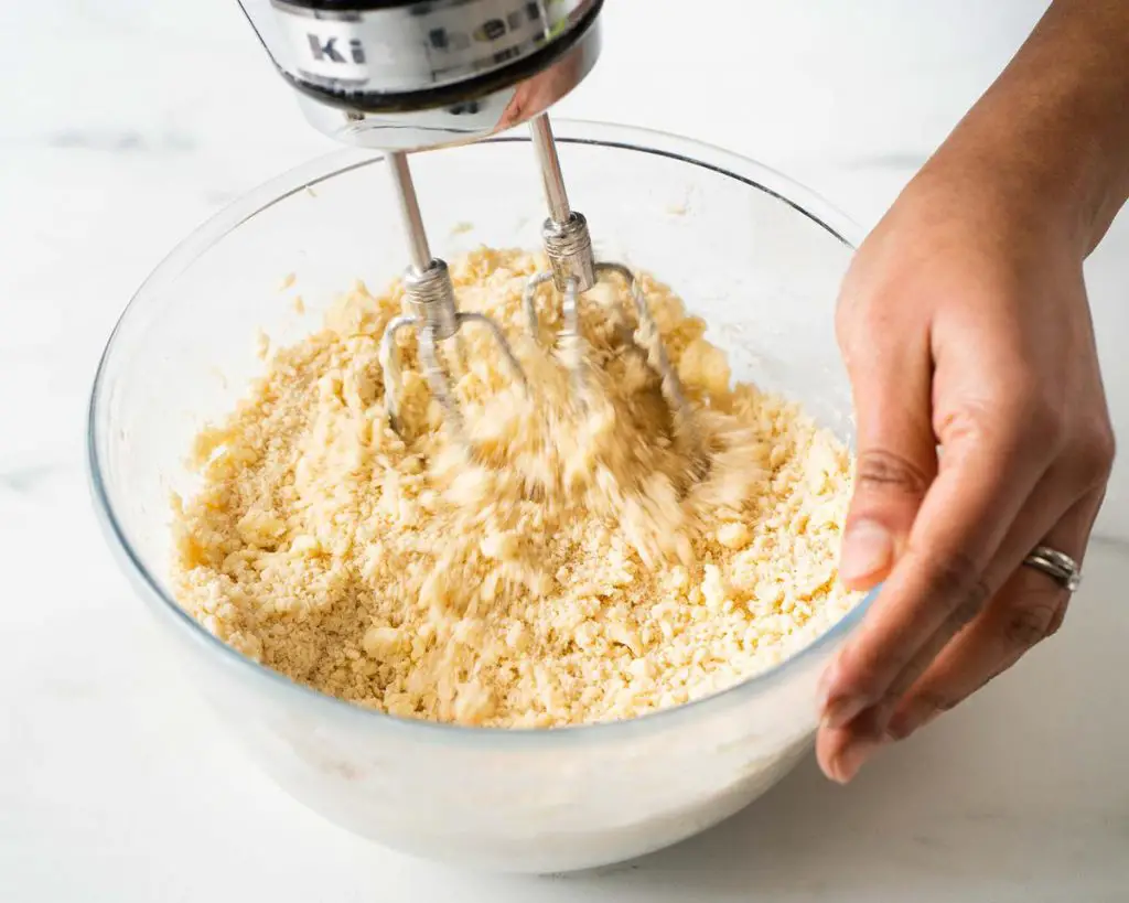 Mixing the biscuit dough together before rolling. Recipe by movers and bakers