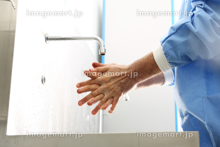 surgical hand disinfection. a doctor washes his hands. the doctor ...