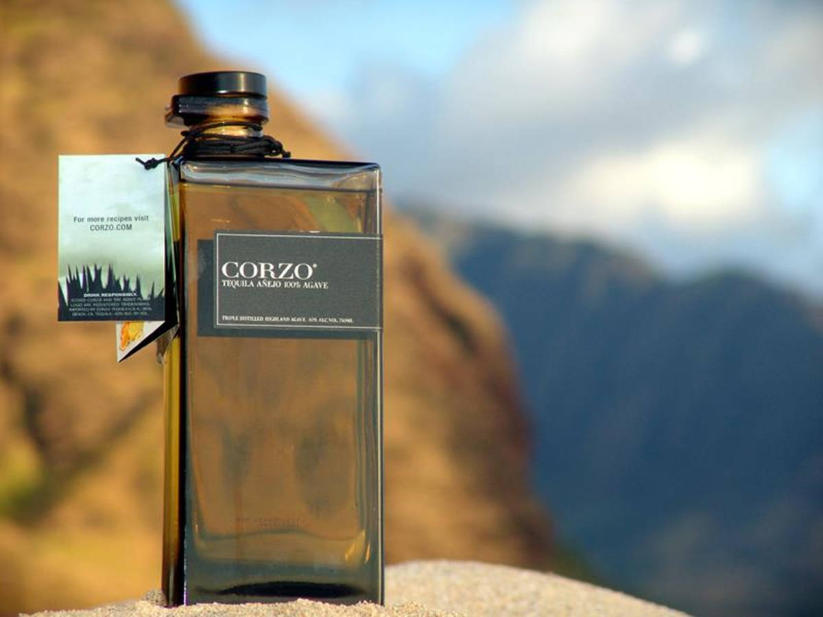 Corzo Anejo Tequila Set Against A Mountainous Backdrop Wallpaper