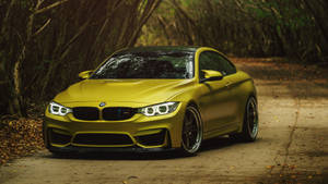 Striking Yellow Bmw M Series In Action Wallpaper