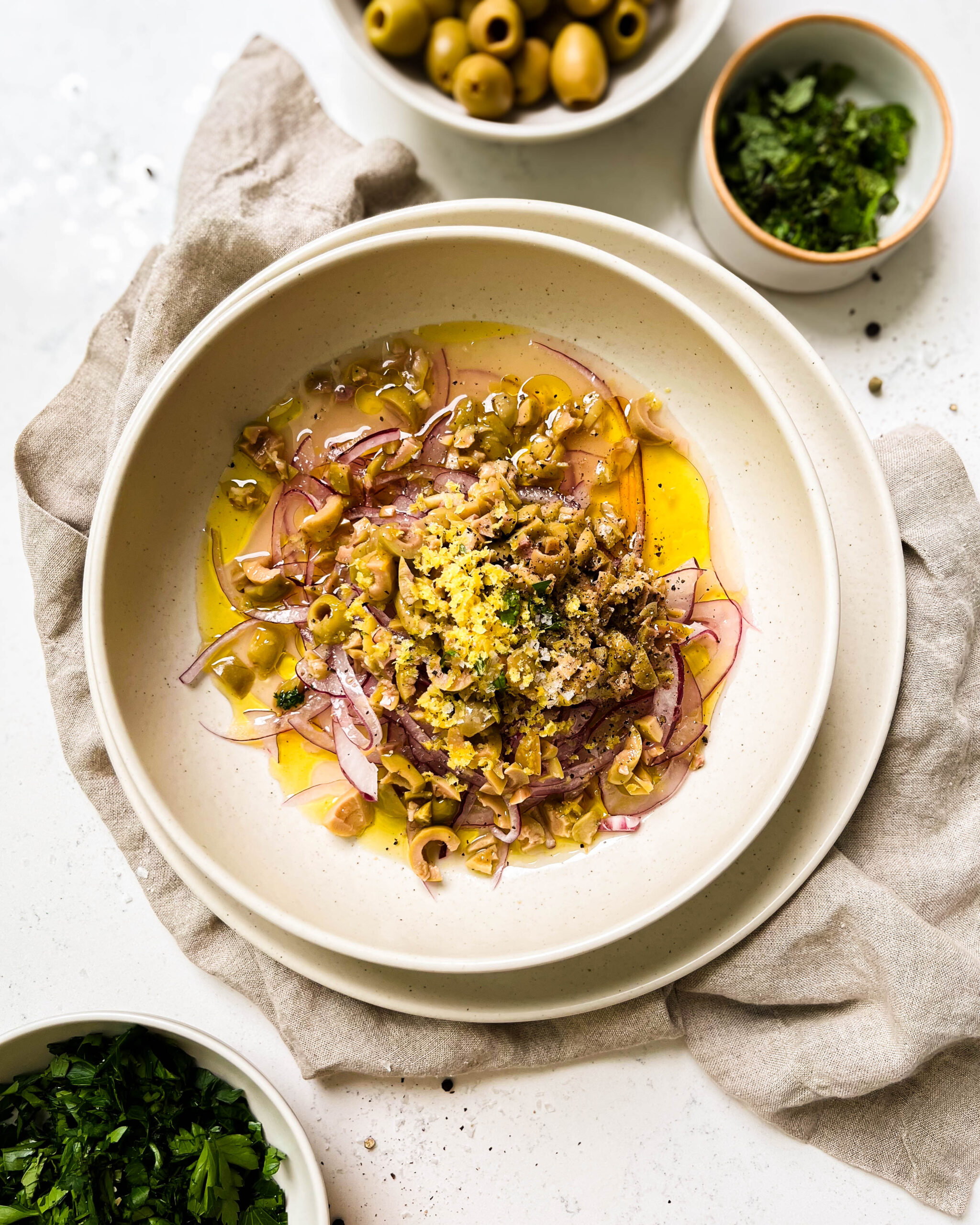 pickled beet salad ingredients in a beige bowl