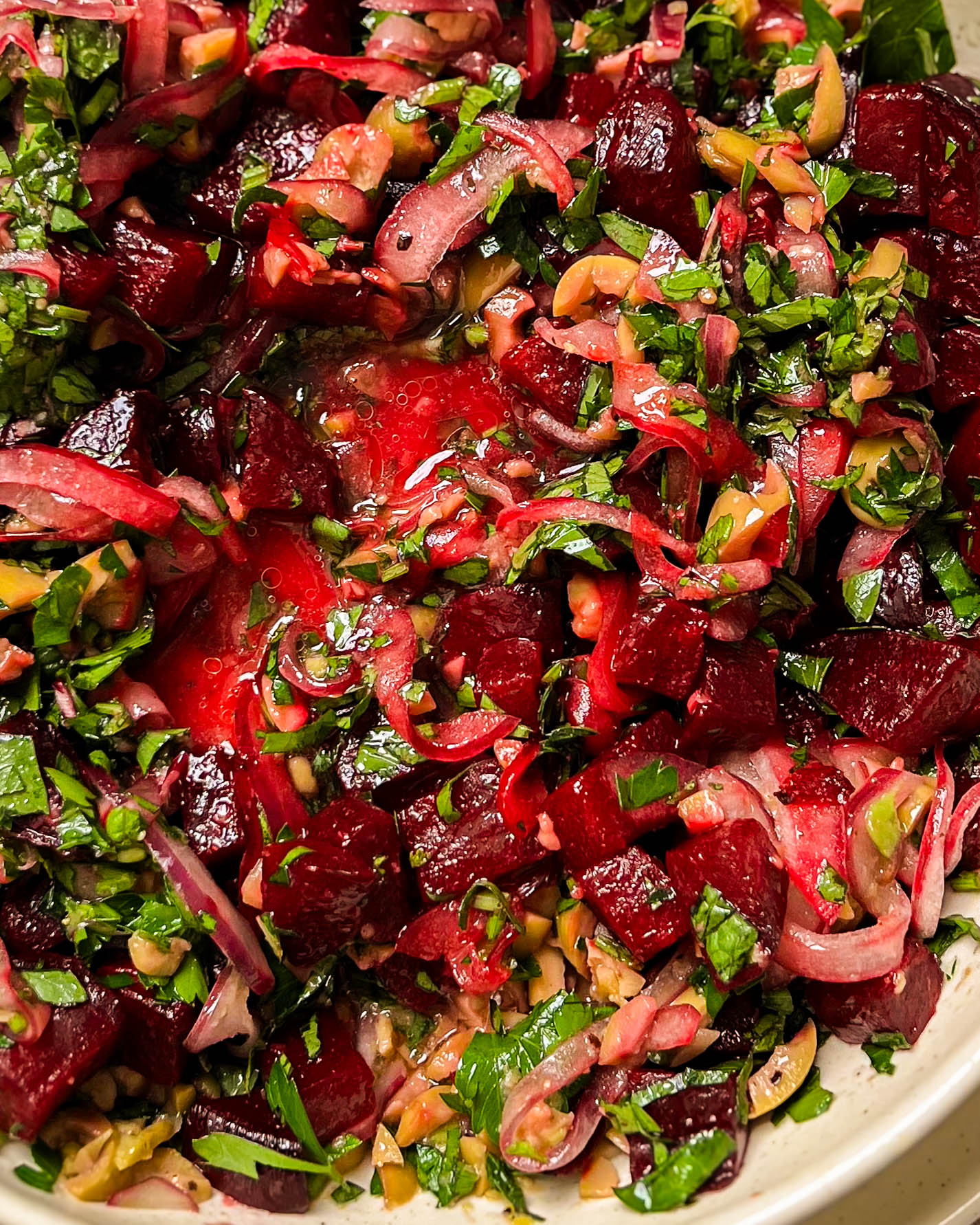 pickled beet salad in a beige bowl