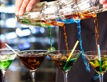 Image of bartender pouring cocktails at a Bar in DIFC