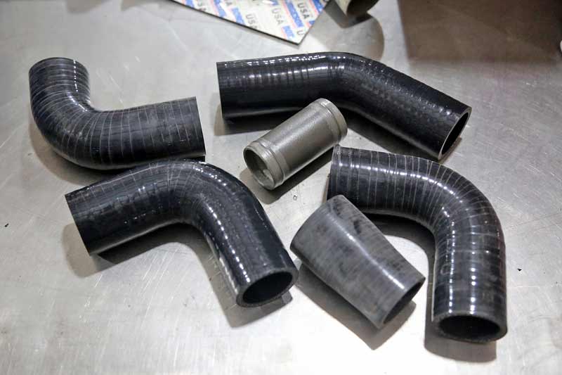 In order to build a custom radiator hose, you need a coupler and some elbows. You can use a new radiator hose and simply cut the bend you need as well.