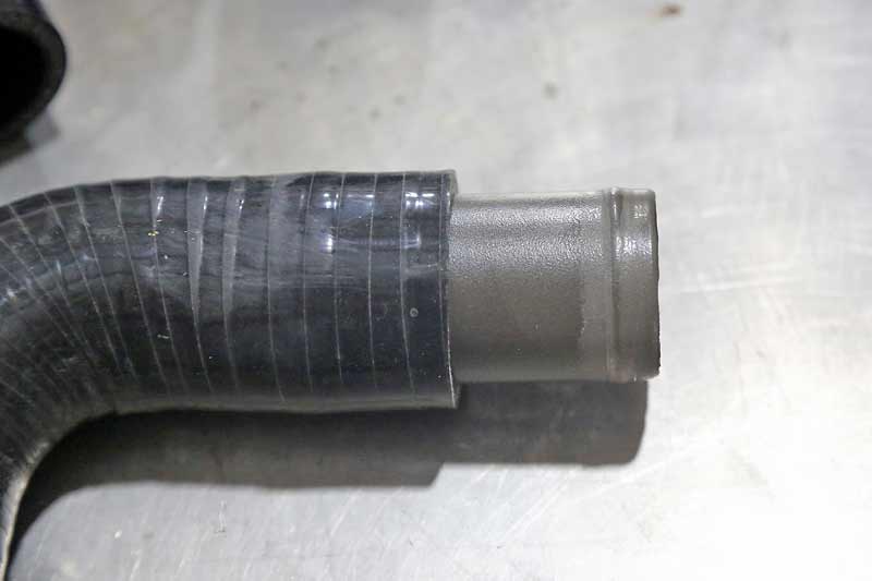 The coupler installs into the hose like this. If you are using a short coupler, install it about half-way into each hose.