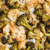 crispy baked cauliflower and broccoli on a baking sheet