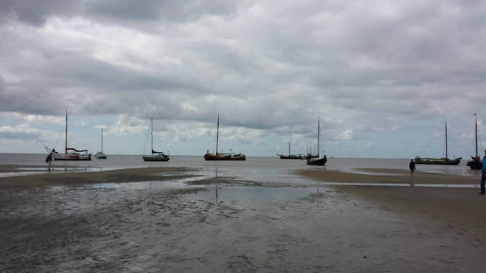 Ships aground during low tide near Terschelling, a Wadden Islands in The Netherlands