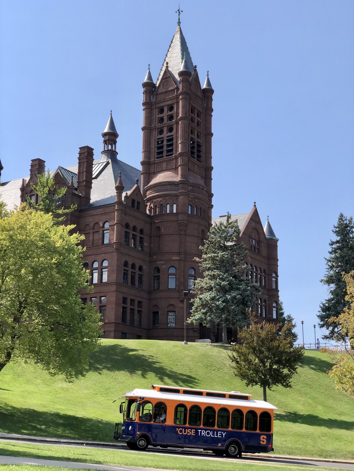 trolley bus driving by Crouse College