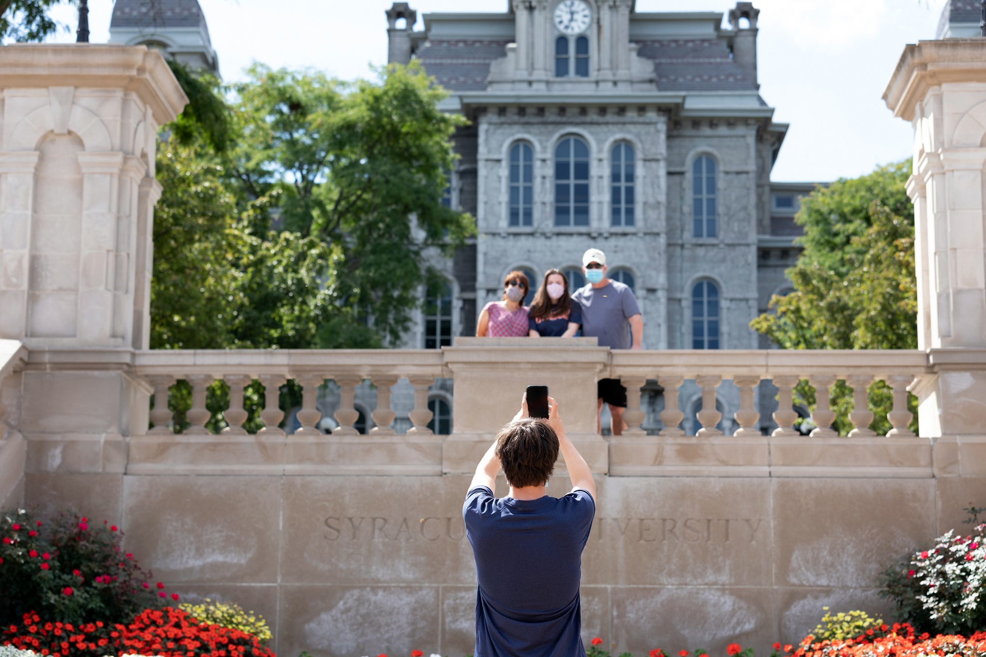 person taking picture of group of people