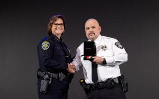 UCIPD Chief Liz Griffin presents the Lifesaving Award to Public Safety Responder Jose Gallardo.