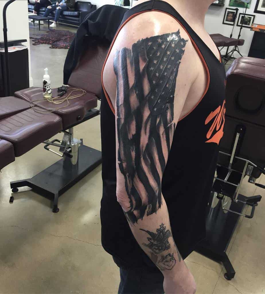 Man with American flag tattoo on arm