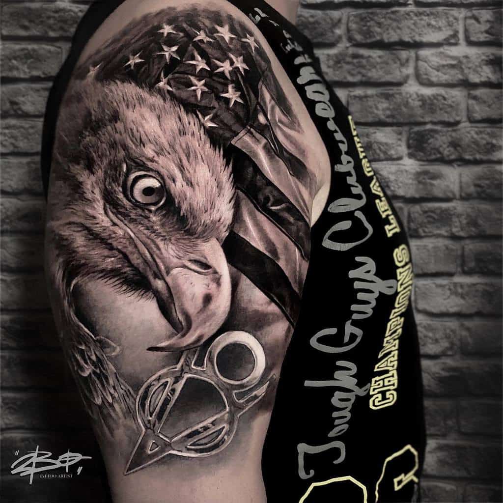 Tattoo of an eagle and American flag on a man's arm