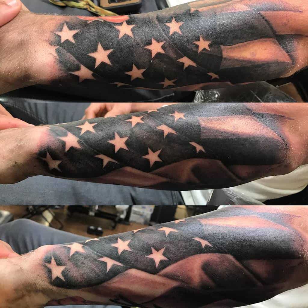 Forearm tattoo of the American flag with stars and stripes