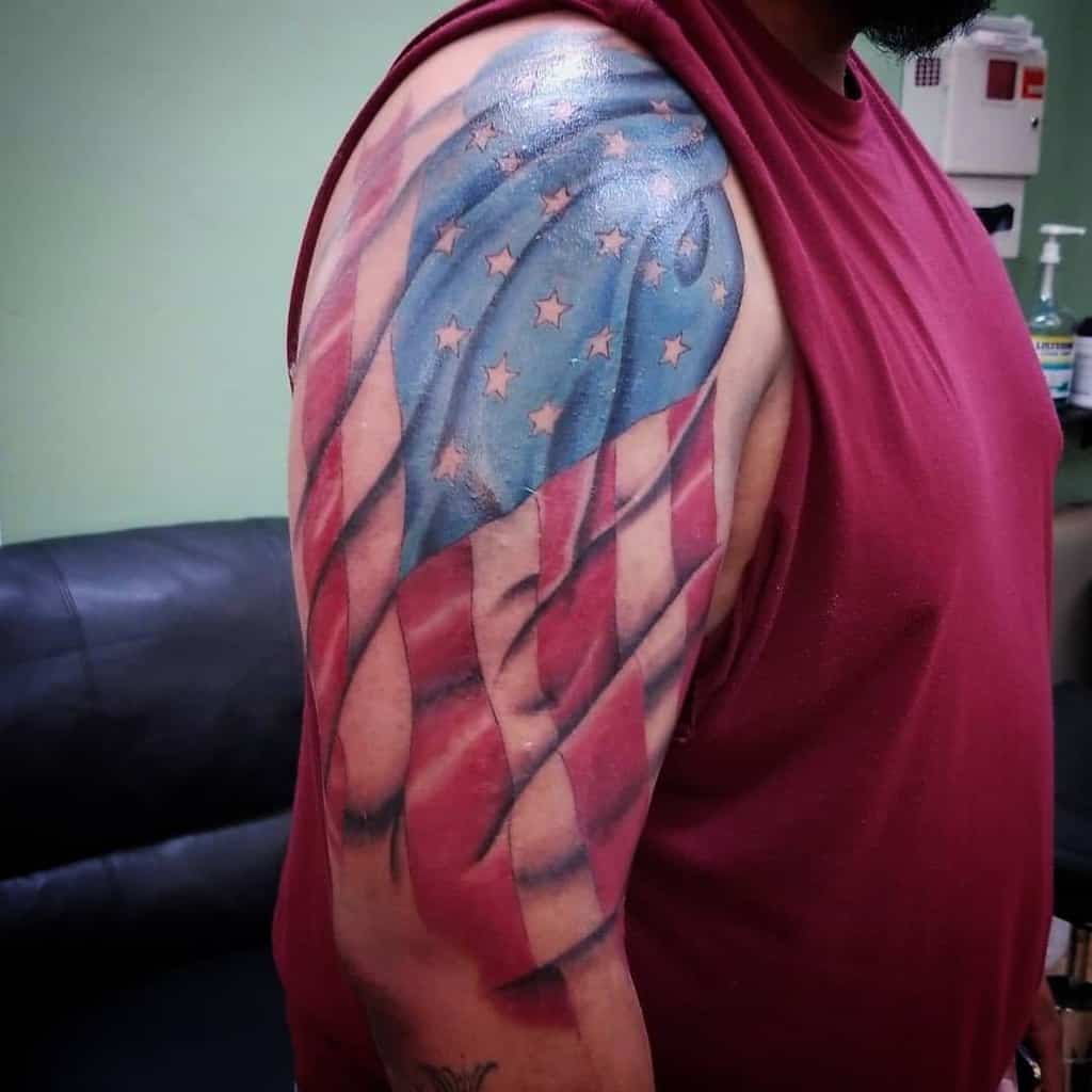 Man with an American flag tattoo on his upper arm