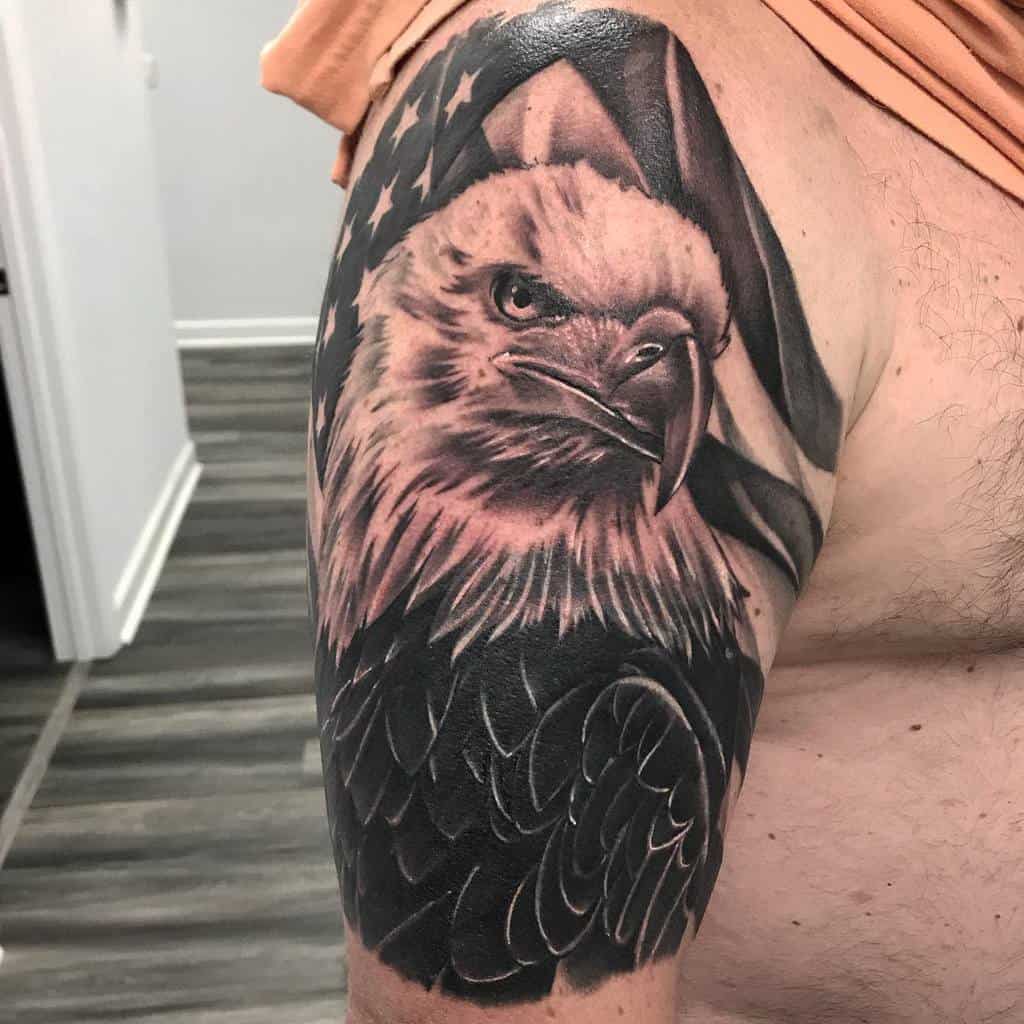 Eagle tattoo on arm with American flag in the background