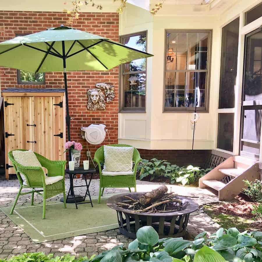 cheap patio ideas green wicker chairs and umbrella