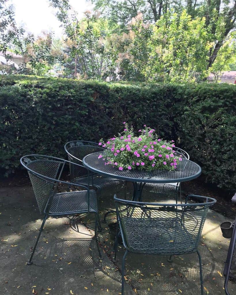 corner patio with metal furniture 