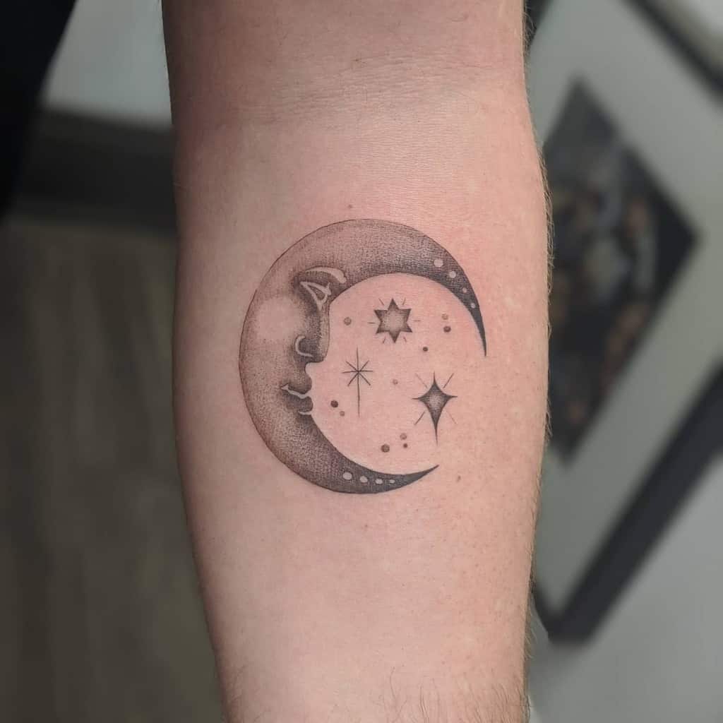 Tattoo of a crescent moon with a face and surrounding stars on a person's forearm