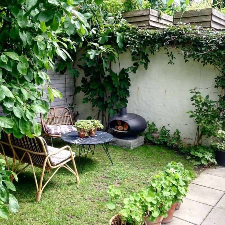 grass area with bamboo seating and fire pit 