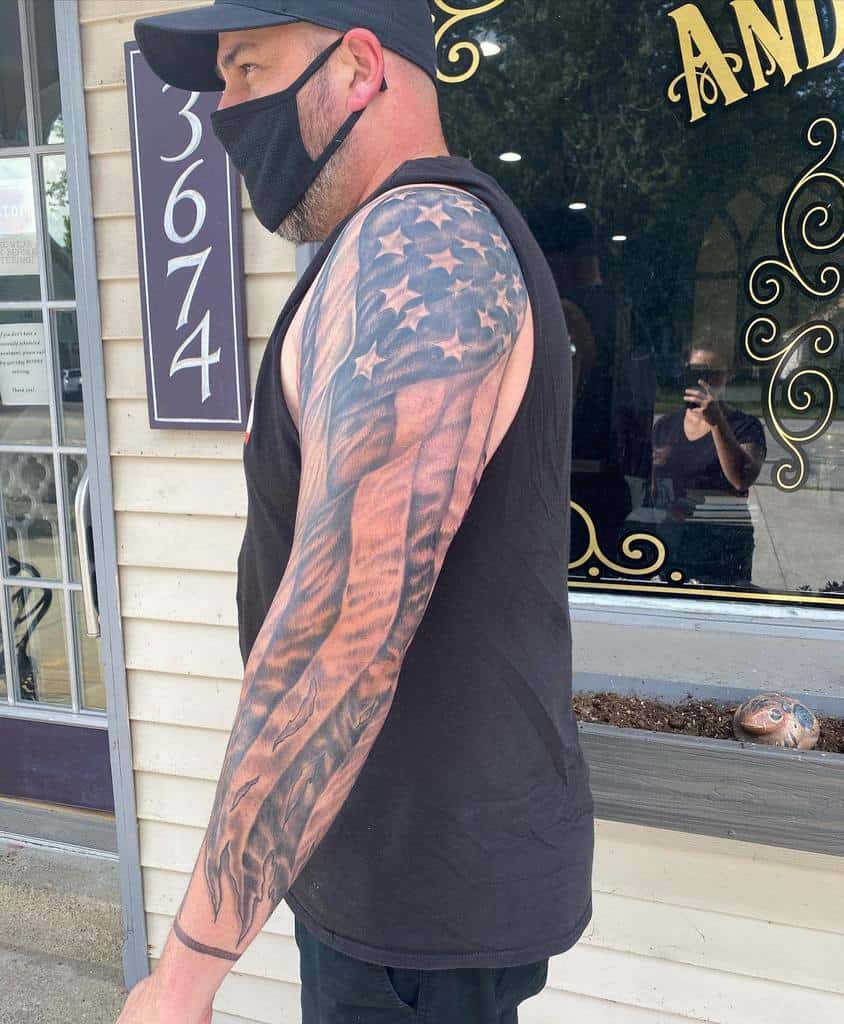 Man with USA-themed sleeve tattoo on his arm