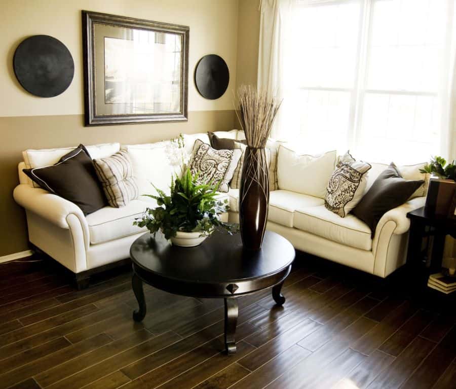 stylish living room with two tone accent wall and hardwood floors