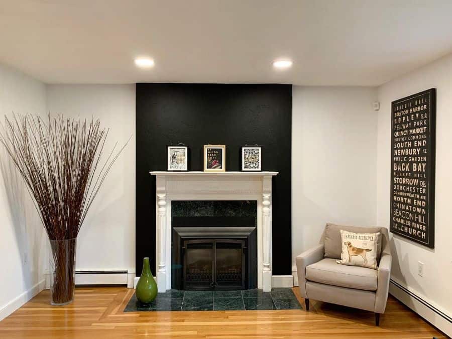 black accent wall around fireplace in modern living space