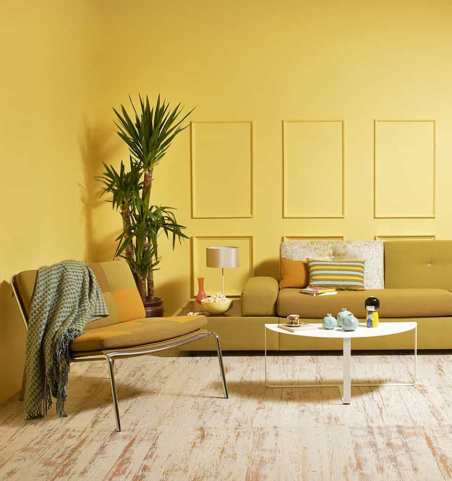 bold yellow living room with sofa and chair 