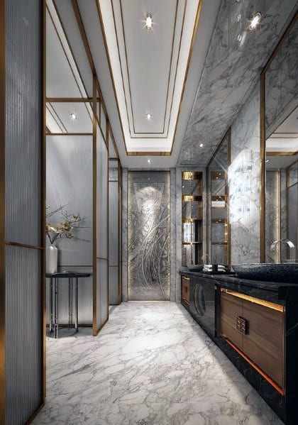 Luxurious modern bathroom with marble floors, mirrored walls, and gold accents.