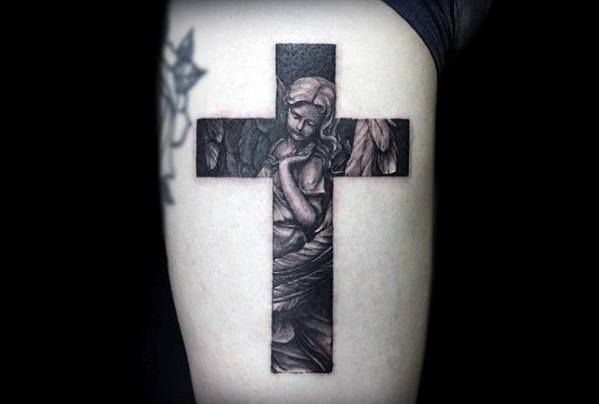 Gentleman With Small Religious Angel Cross Tattoo On Thigh