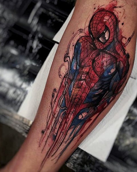 Forearm tattoo of Spider-Man in a dynamic pose with abstract red and black elements