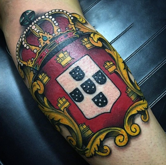 Male Royal Family Crest Tattoo On Bicep With Crown