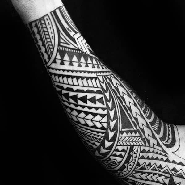 Man With Forearm Sleeve Tattoo Polynesian Tribal Design