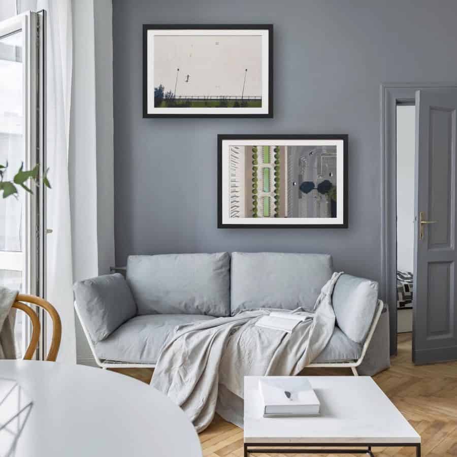 gray living room with sofa and framed wall art