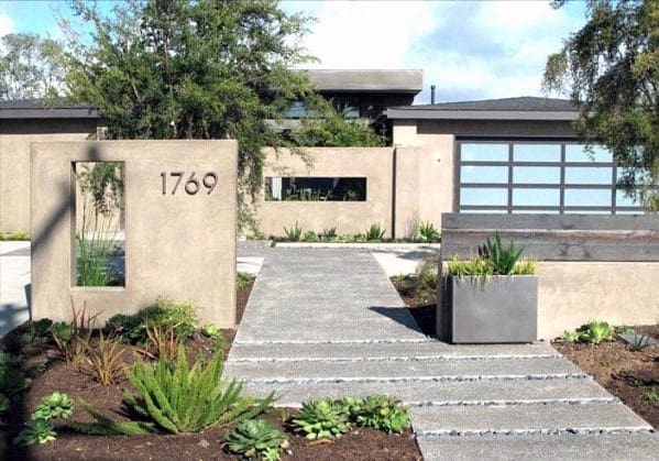 concrete steps with landscaping pebbles 