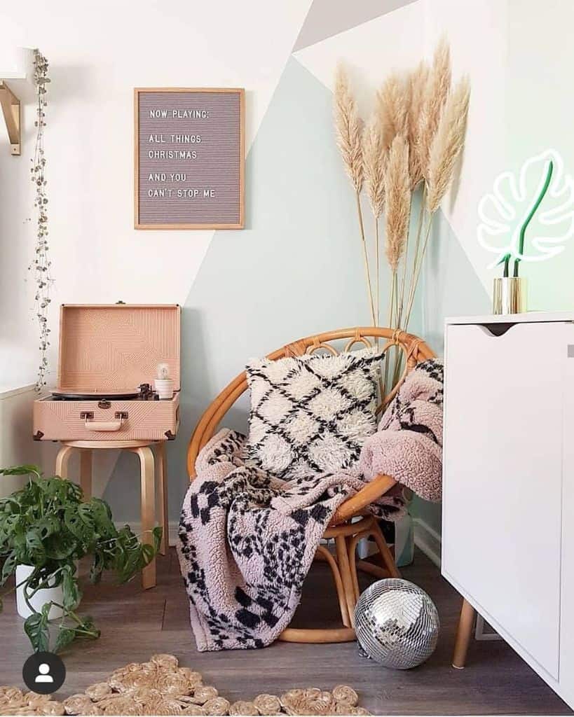 retro style living room with portable record player and cane chair 