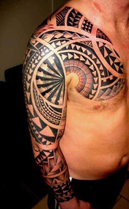 Intricate Polynesian tattoo covering a man's shoulder and entire arm