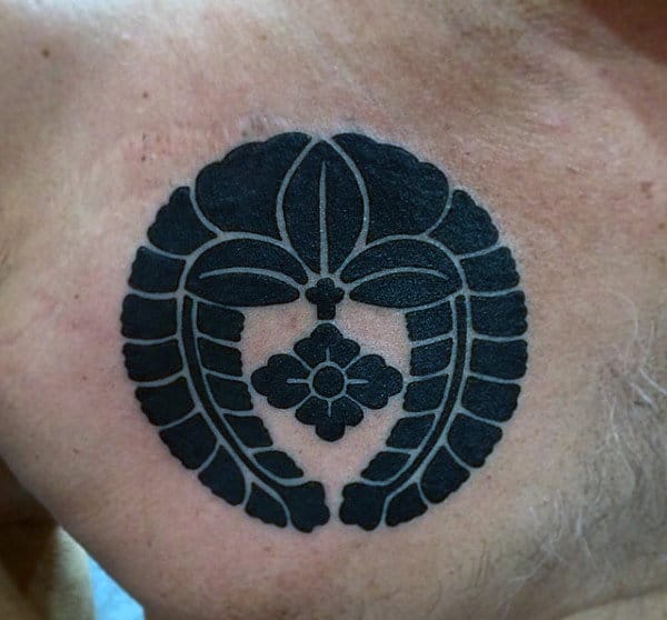 Simple Male Japanese Family Crest Tattoo On Upper Chest