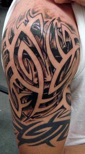 Abstract black tribal tattoo on upper arm