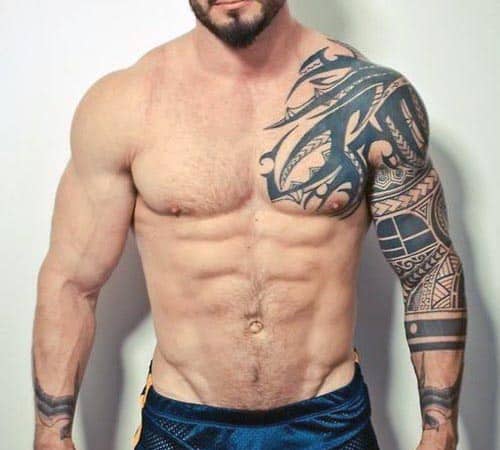 Muscular man with intricate tribal tattoos on his right arm and shoulder