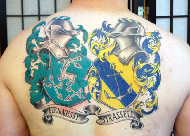 Two Family Crest Tattoos On Mens Back