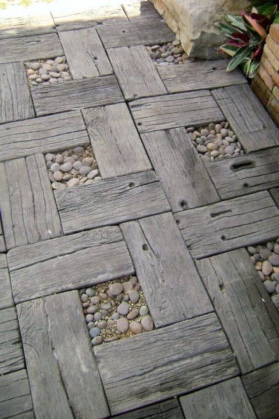 wood board pattern with pebble rocks walkway